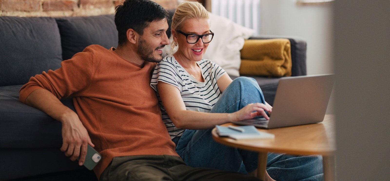 young couple looking at a laptop