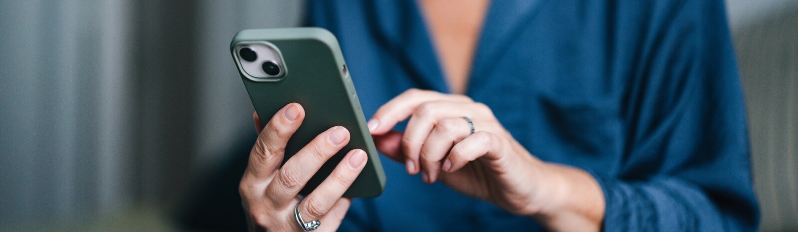 close-up of hands holding a smartphone