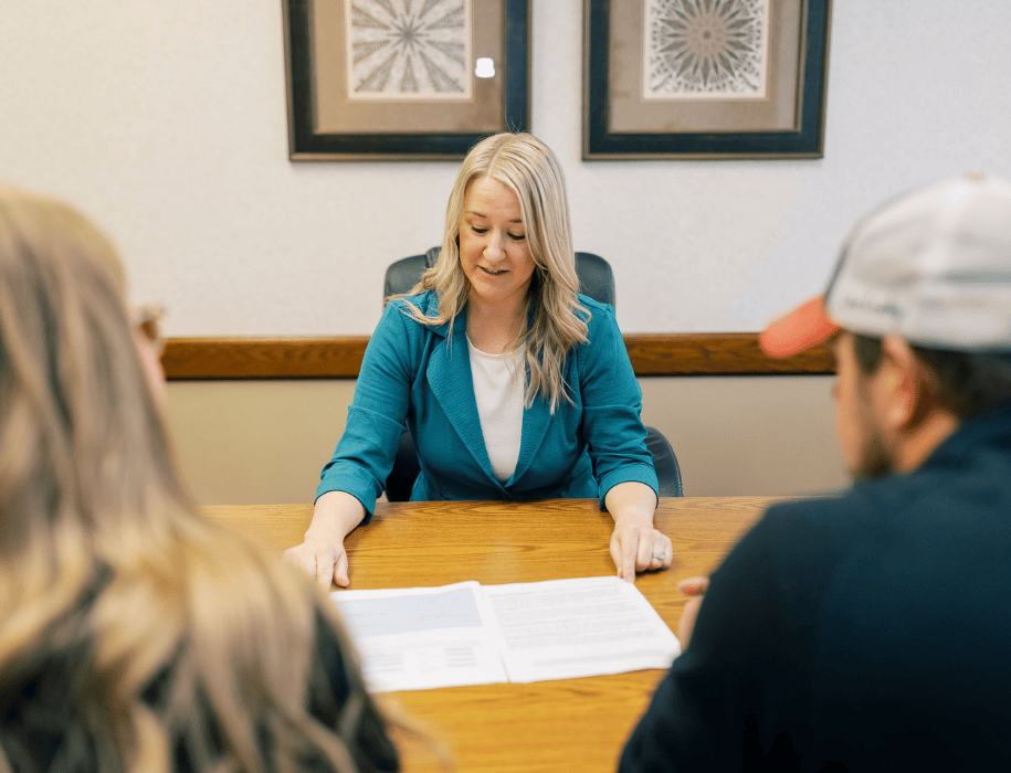 Trust officer explaining documents to customers
