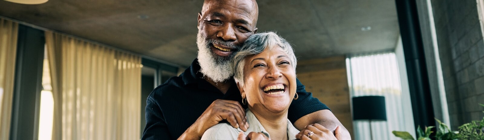 mature couple smiling and hugging