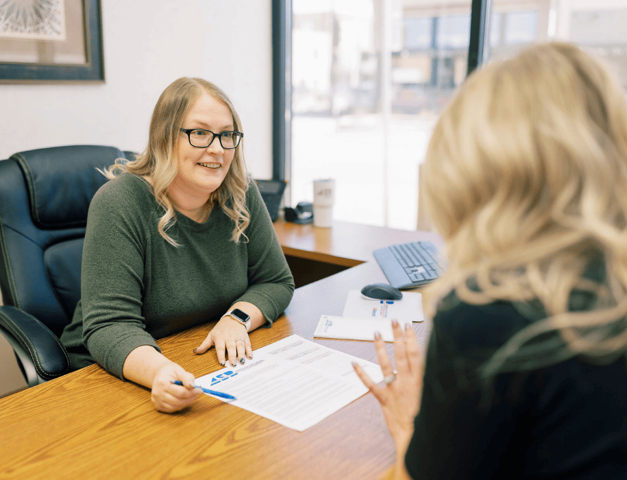 Lender explaining document to customer