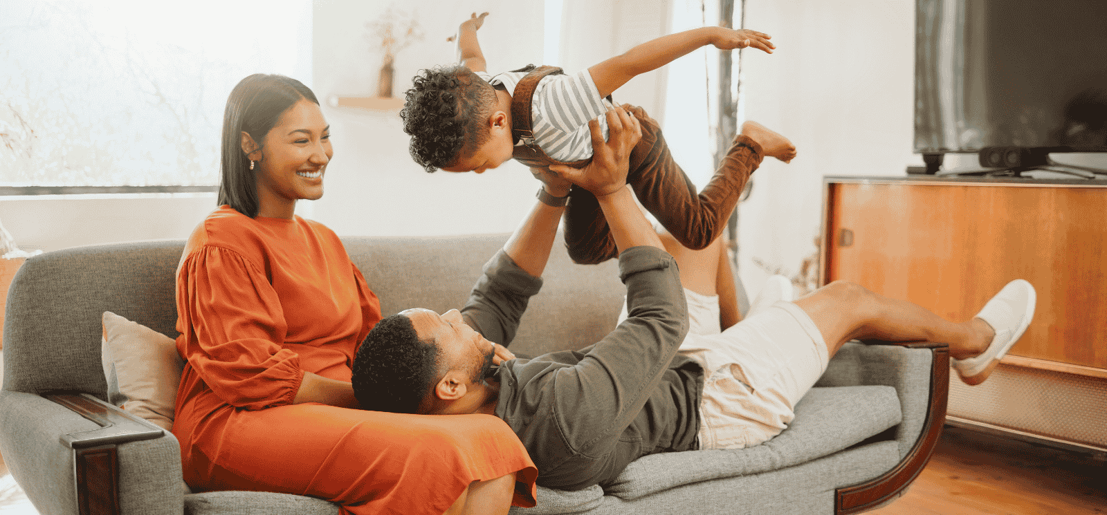 Family playing on couch
