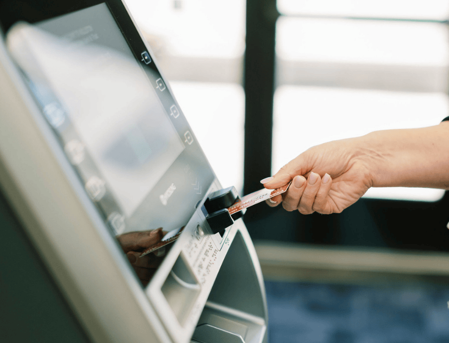 Person inserting card at atm