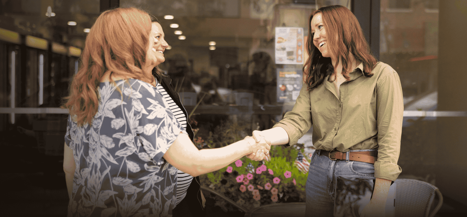 Lender shaking hands with customer