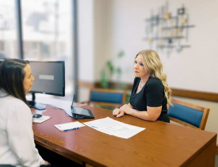 Customer in office listening to rep