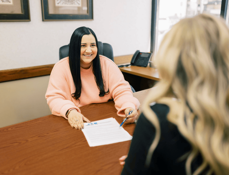 Lender explaining document to customer