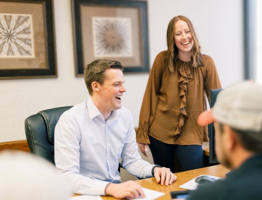 Lenders laughing with customer