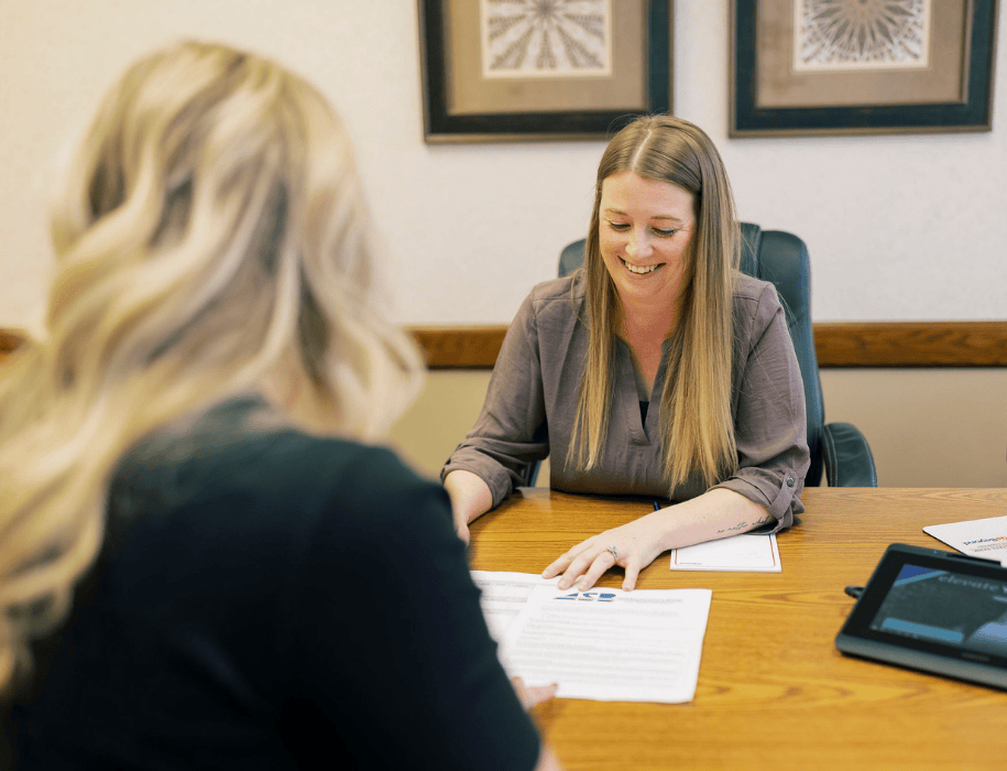 Lender explaining documents to customers